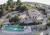 spectacular aerial view of the house which rises majestically on the top of the hill